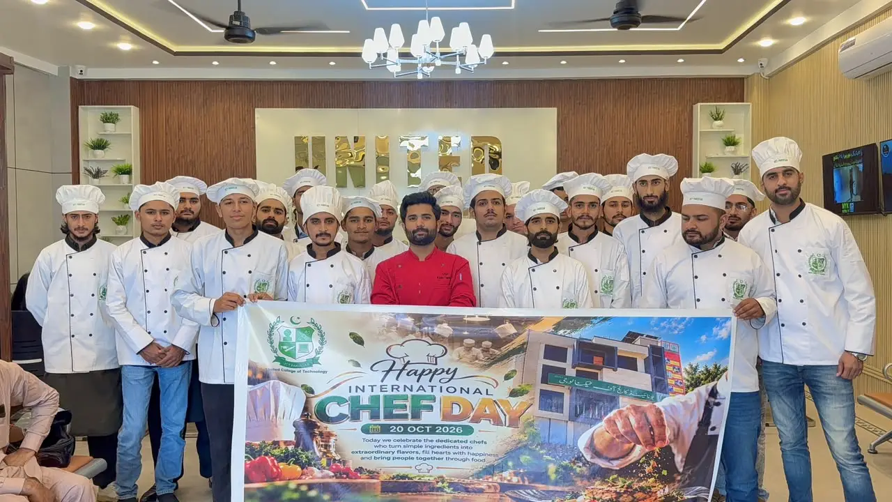Chef Azan Tanveer with culinary students holding the Chef Day banner