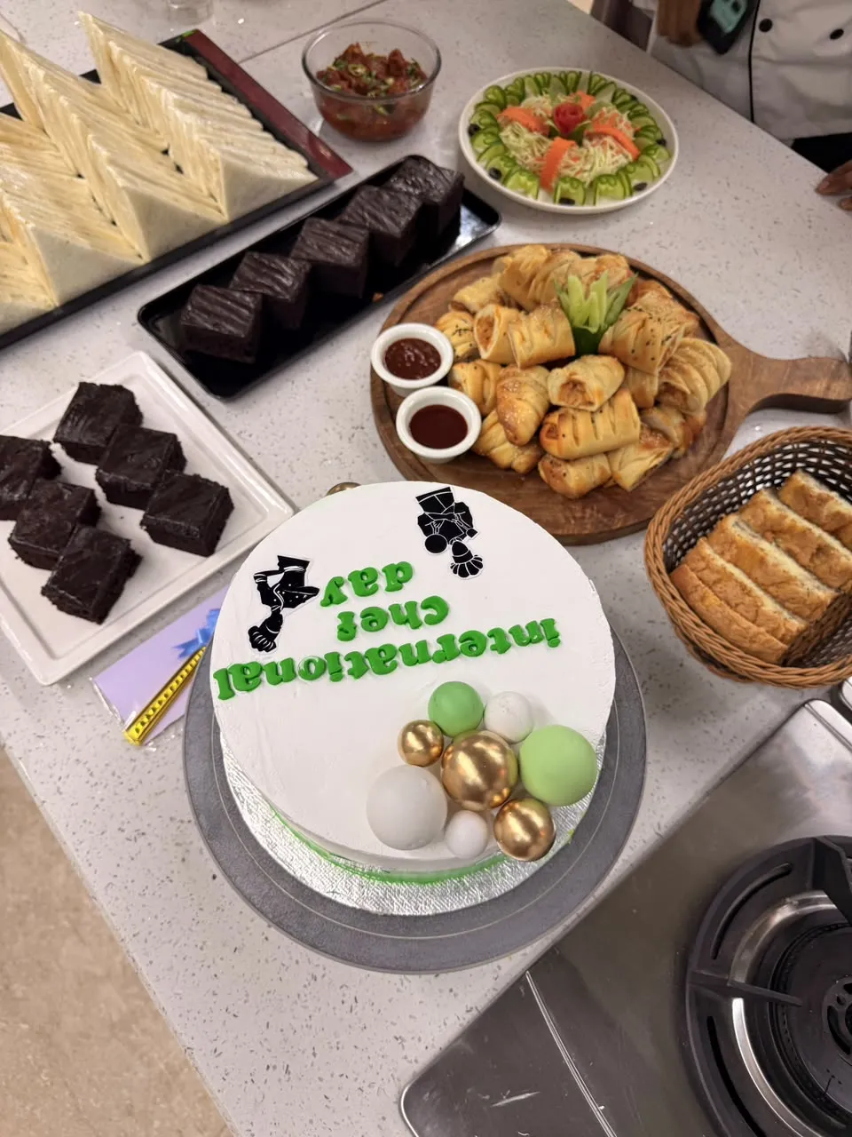 International Chef Day cake with pastries and brownies