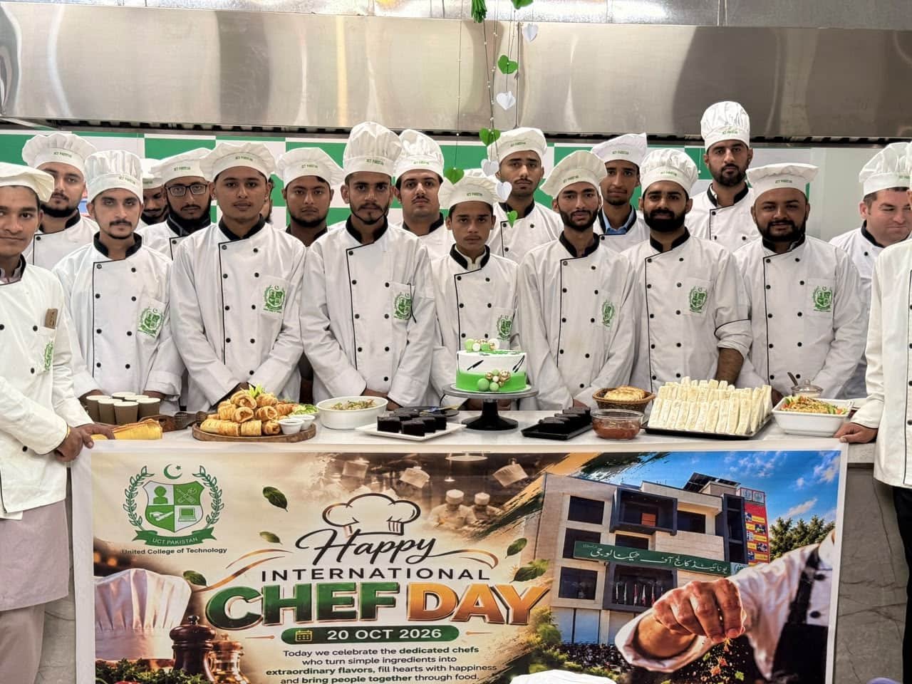 Culinary students with the International Chef Day banner and food display