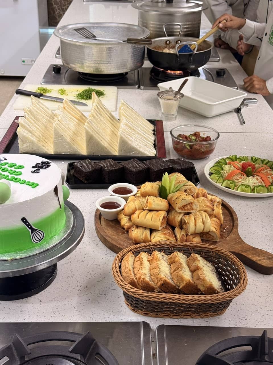 Sandwiches, pastries, cake and salad prepared for International Chef Day